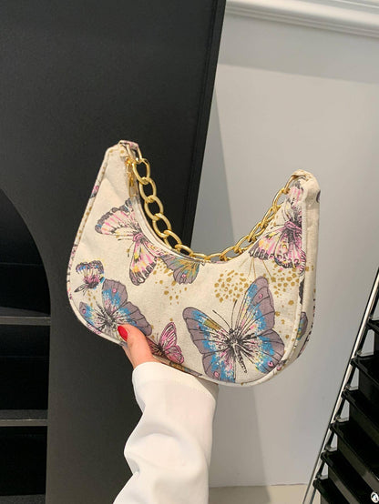 Bolso de mano con forma de media luna y flores