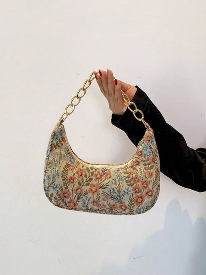 Bolso de mano con forma de media luna y flores