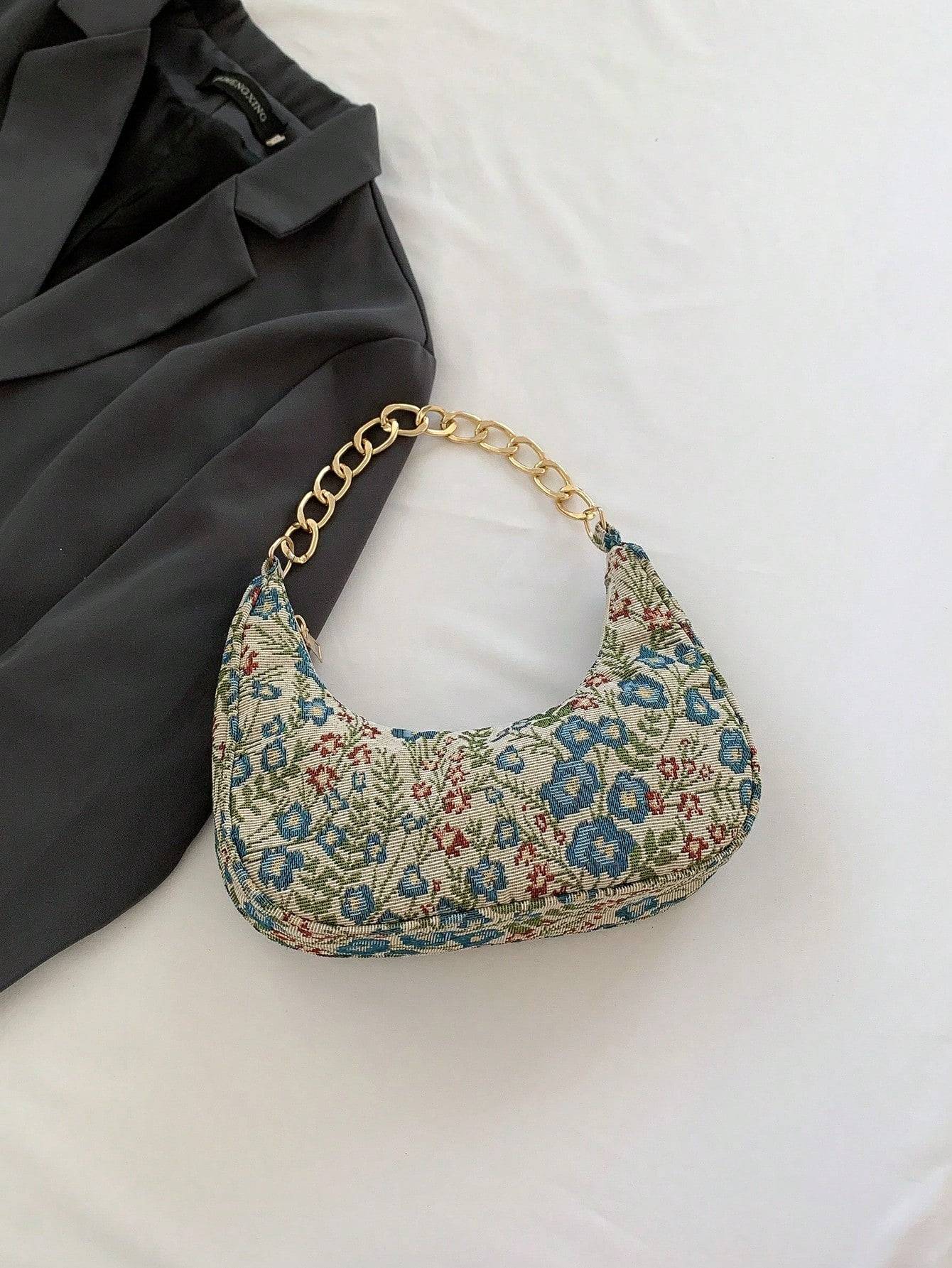 Bolso de mano con forma de media luna y flores