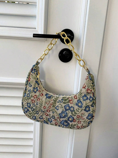 Bolso de mano con forma de media luna y flores