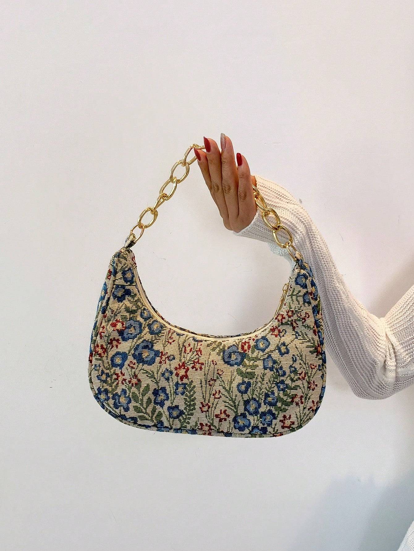 Bolso de mano con forma de media luna y flores