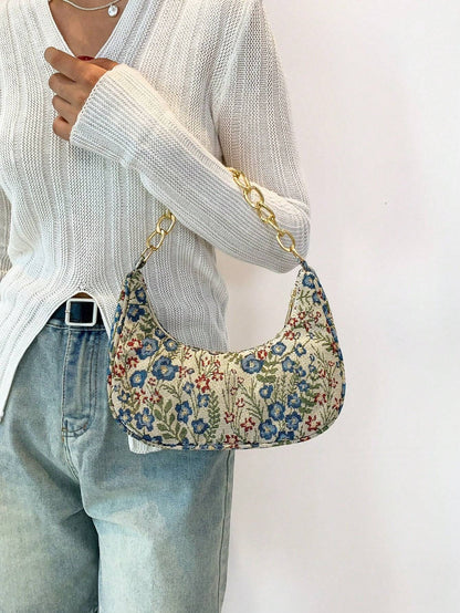 Bolso de mano con forma de media luna y flores