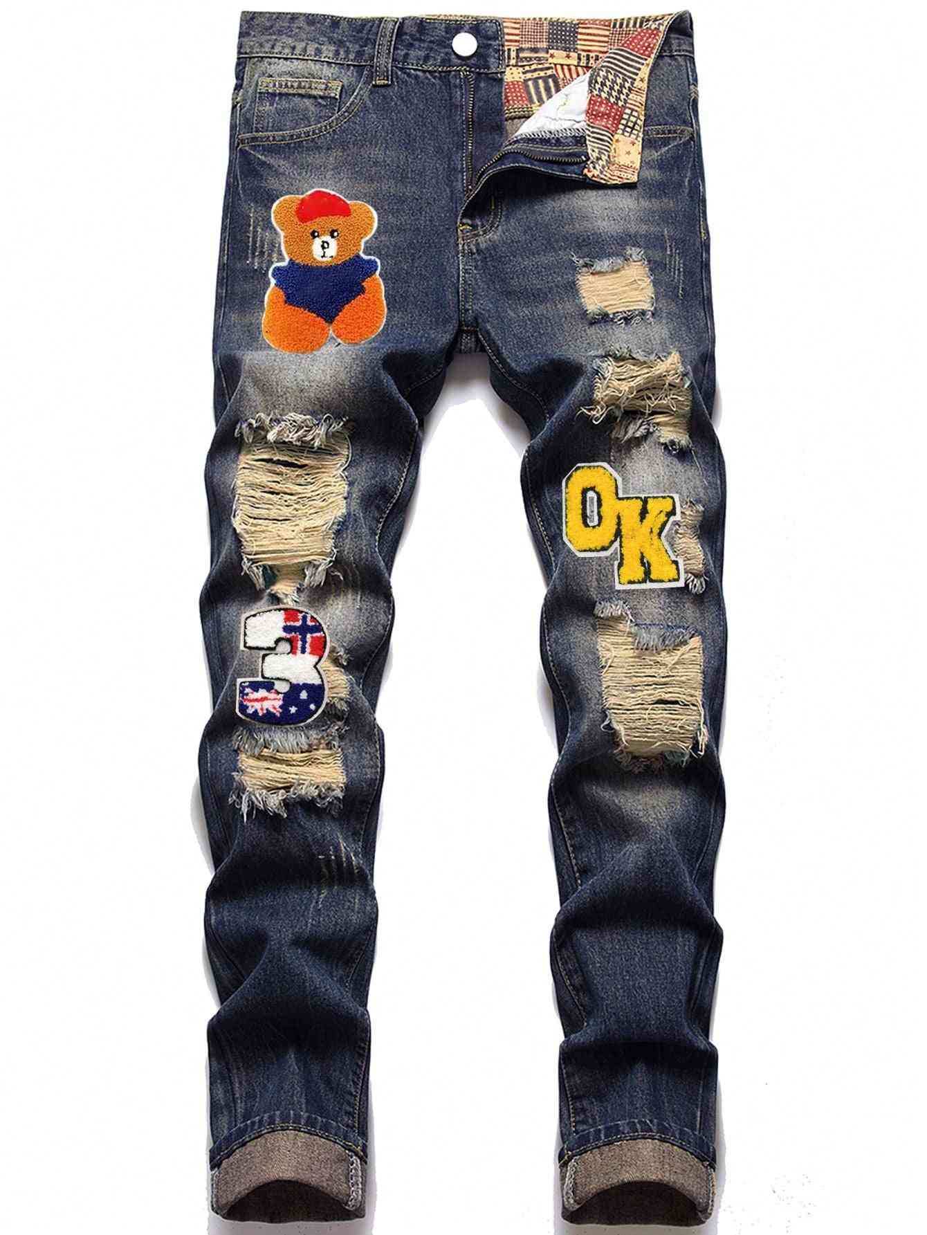 Tween boy's ripped jeans with teddy bear patch, distressed details, and embroidered accents. Stylish and comfortable denim for active kids.