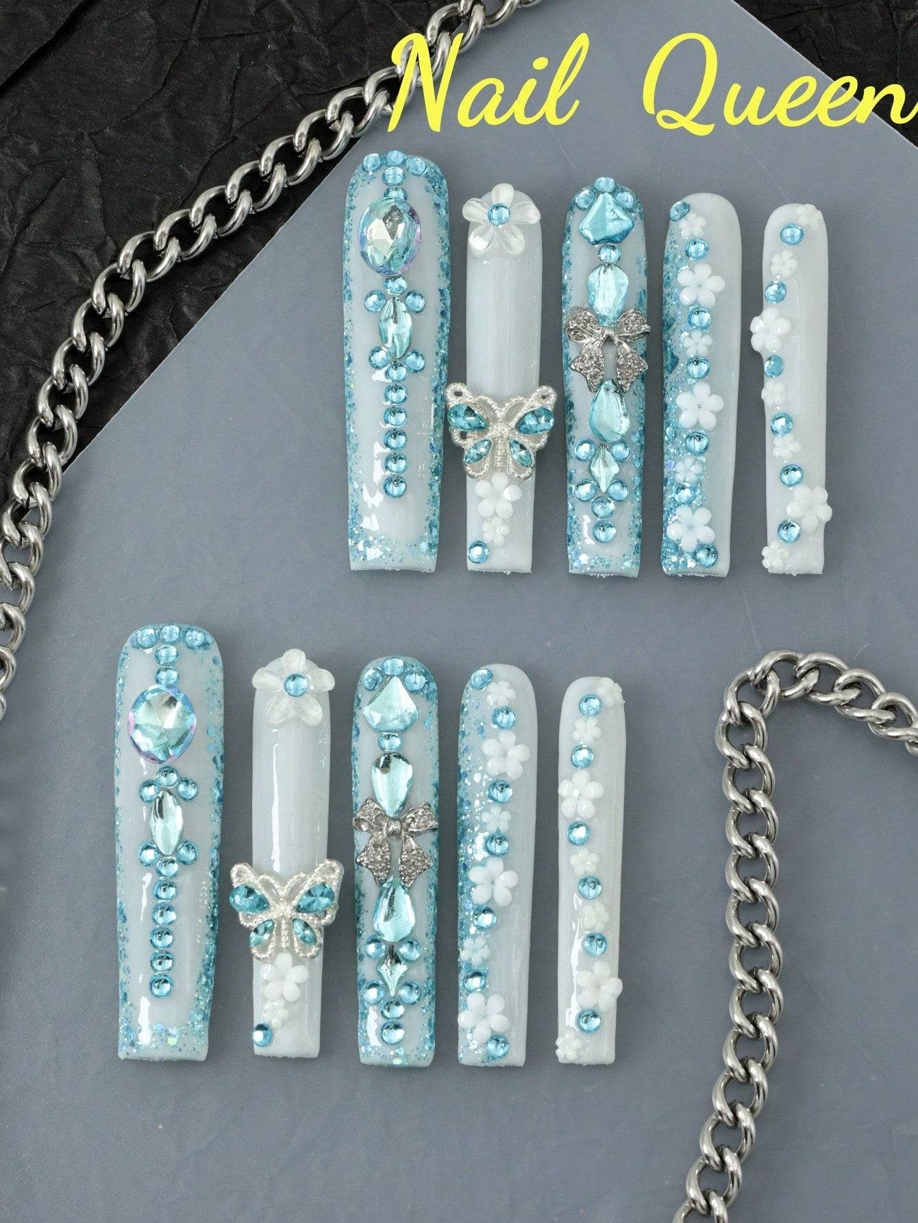 10-piece enchanting butterfly & flower press-on nails with shimmering blue rhinestones and 3D metallic butterfly accents for an elegant look.