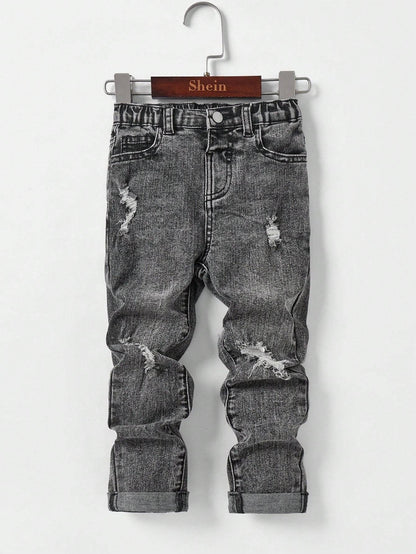 Kids' black denim jeans with distressed details and rolled-up cuffs, designed for comfort and durability in daily activities.