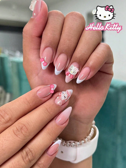 24-piece press-on nail set featuring almond-shaped false nails with 3D Hello Kitty bows, pearls, and French tips for a cute, stylish manicure.