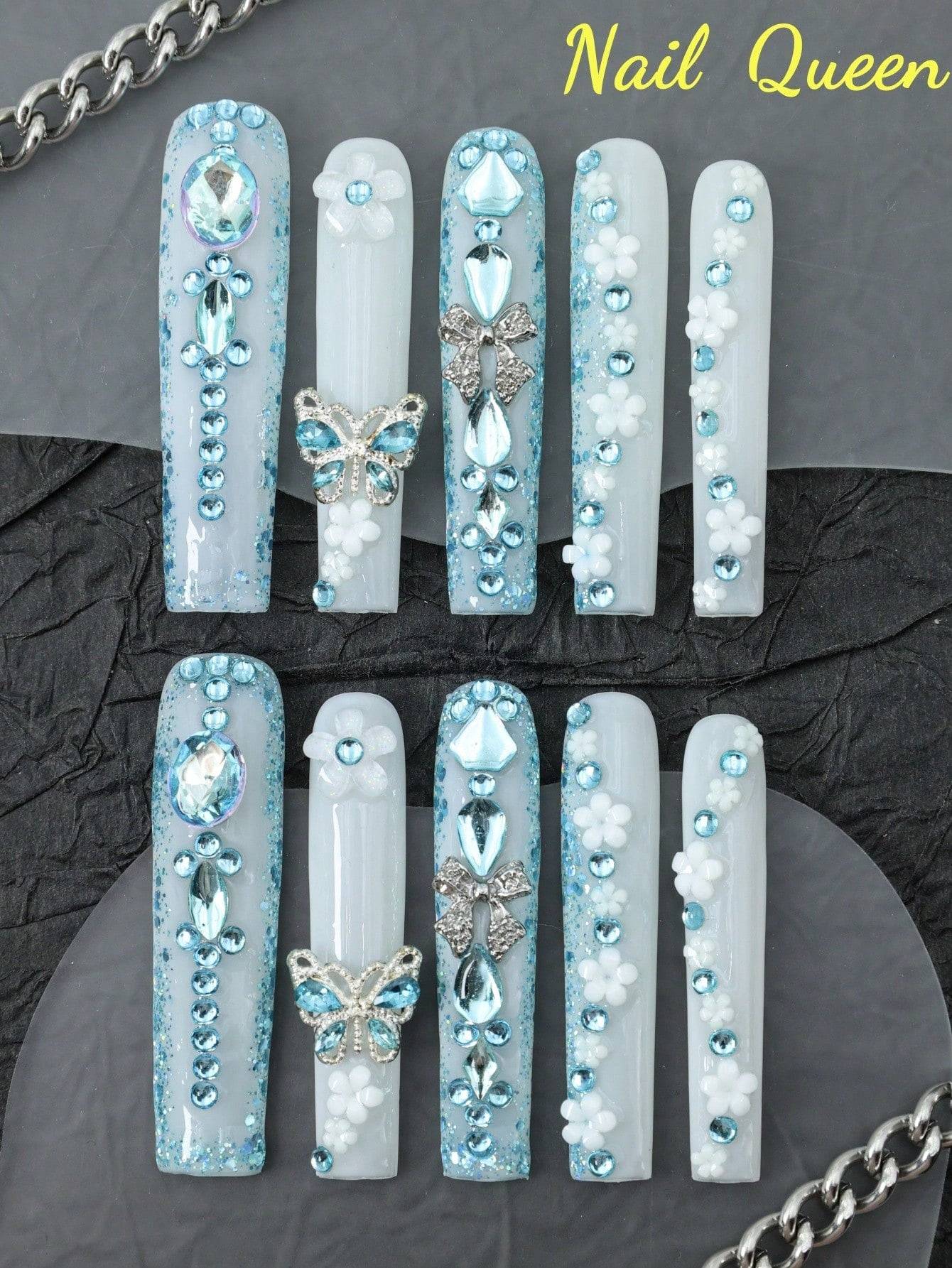 10-piece enchanting butterfly & flower press-on nails with shimmering blue rhinestones and 3D metallic butterfly accents for an elegant look.