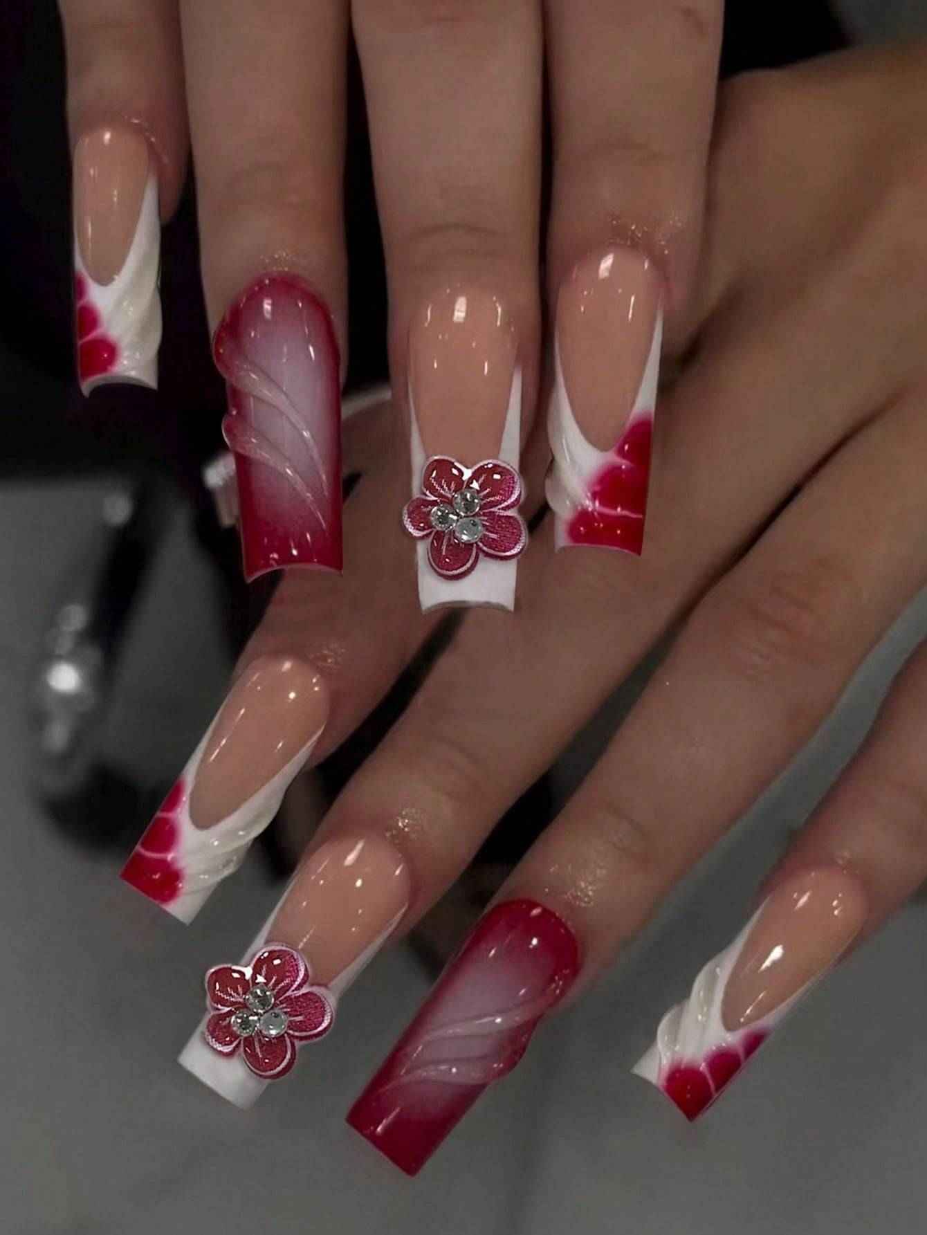 Floral French Tip Press-On Nails with elegant 3D flower accents and a red-to-white gradient design. Perfect for a salon-quality manicure at home.