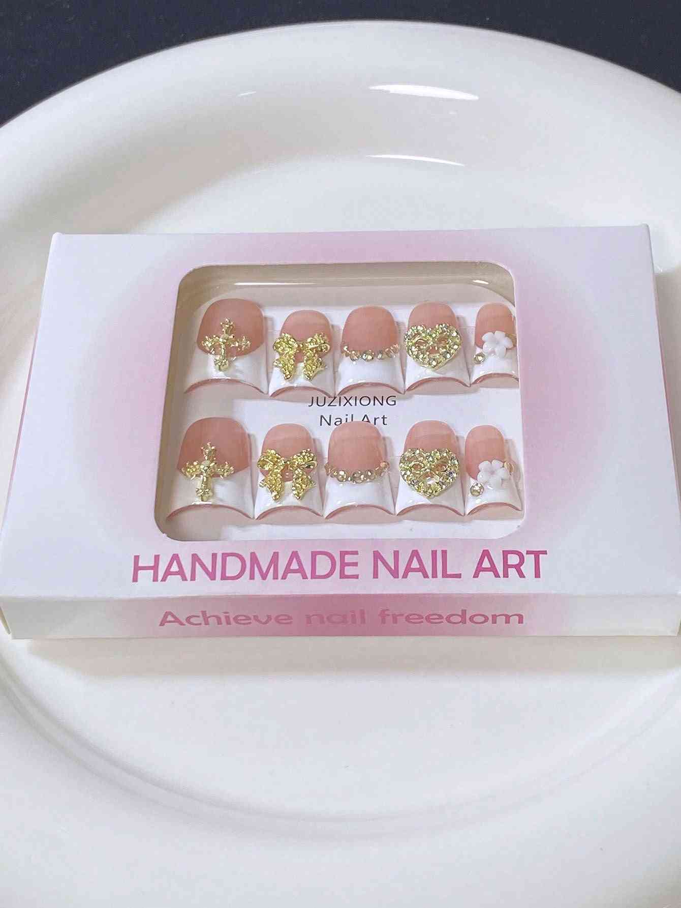 A luxury 10-piece press-on nail set inside the packaging.