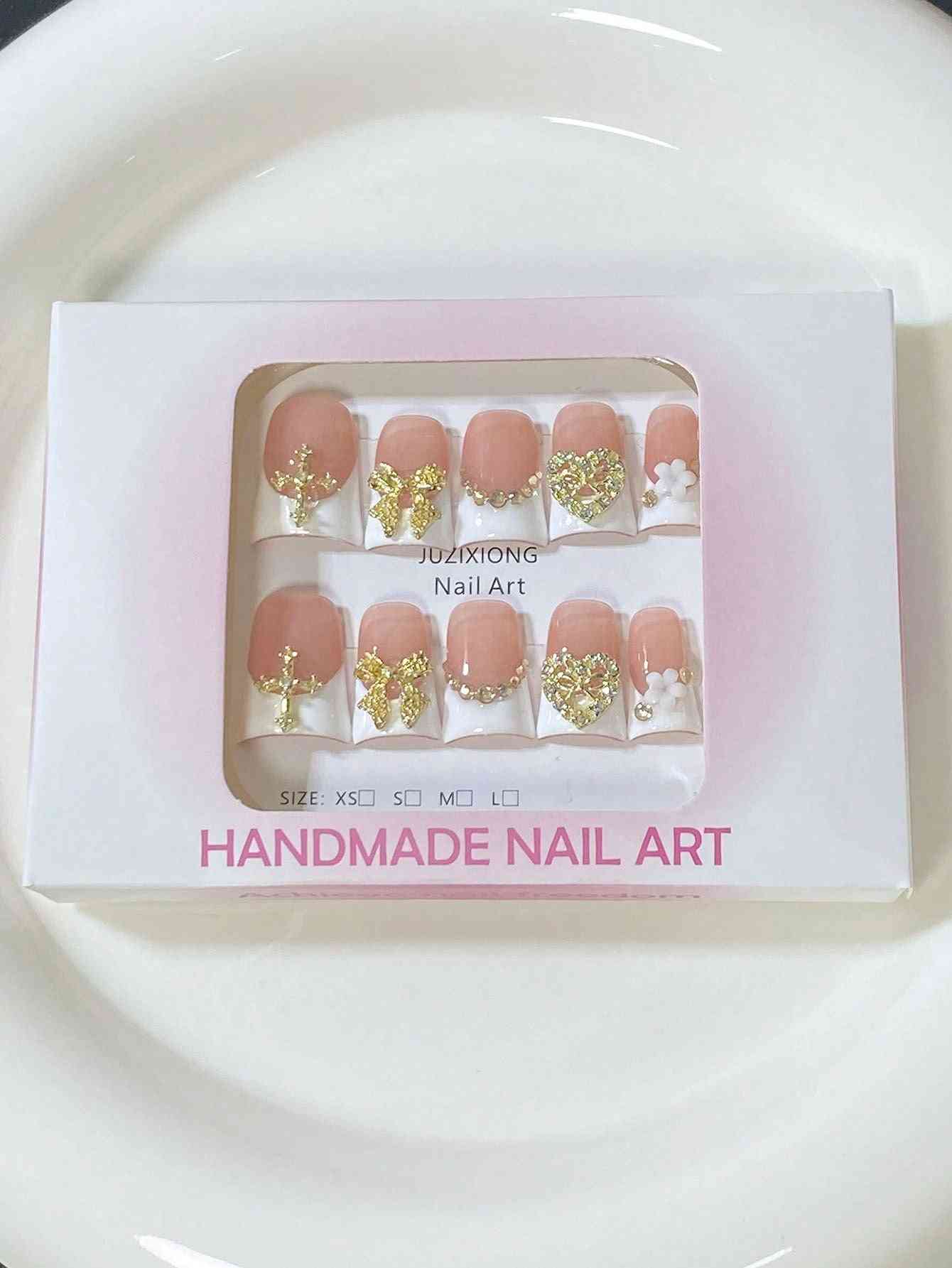 A luxury 10-piece press-on nail set inside the packaging.