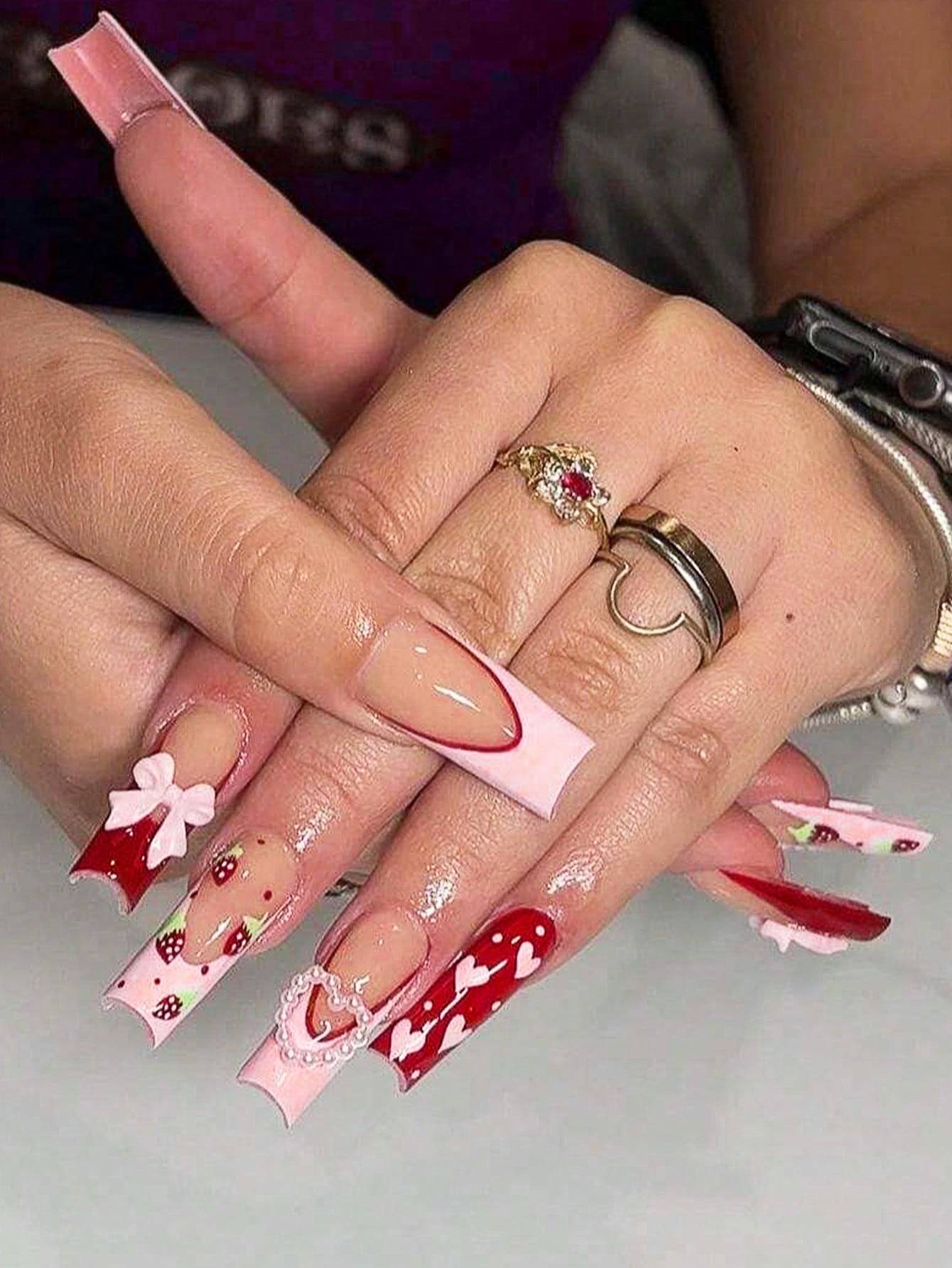 Elegant 24-piece XL square press-on nails featuring a pink and red Valentine’s Day design with heart patterns, bows, and glossy accents.