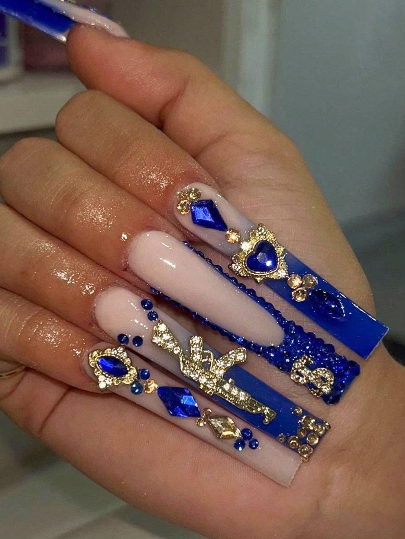 Elegant 24-piece XL square press-on nails featuring a luxurious design with nude and royal blue tones, adorned with gold embellishments and rhinestones.