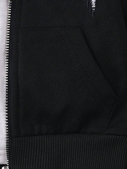 Front pocket detail on black hoodie, providing functionality and a sleek design for baby boys' casual wear.